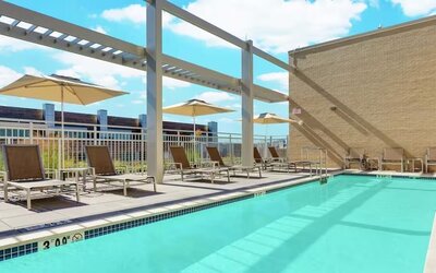 Lovely outdoor pool with pool chairs at Hilton Garden Inn Washington DC / Georgetown Area.