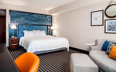 King bedroom with business desk at Courtyard By Marriott Boston Brookline.