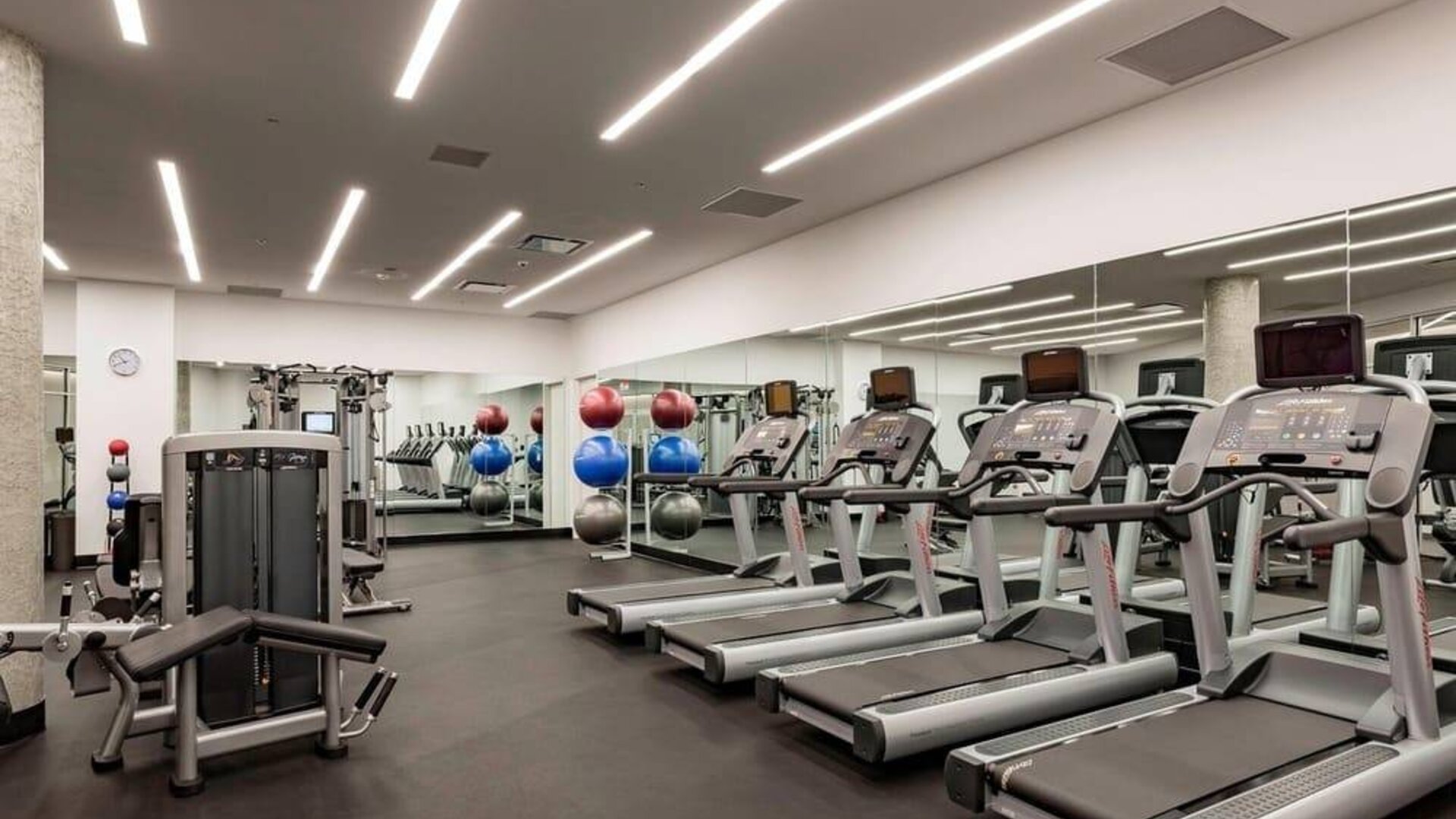 Fitness center available at Courtyard By Marriott Long Island City/New York Manhattan View.