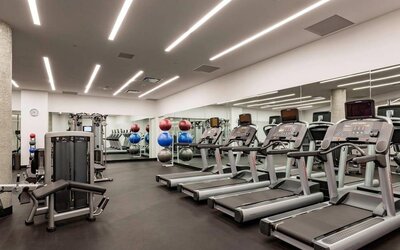 Fitness center available at Courtyard By Marriott Long Island City/New York Manhattan View.