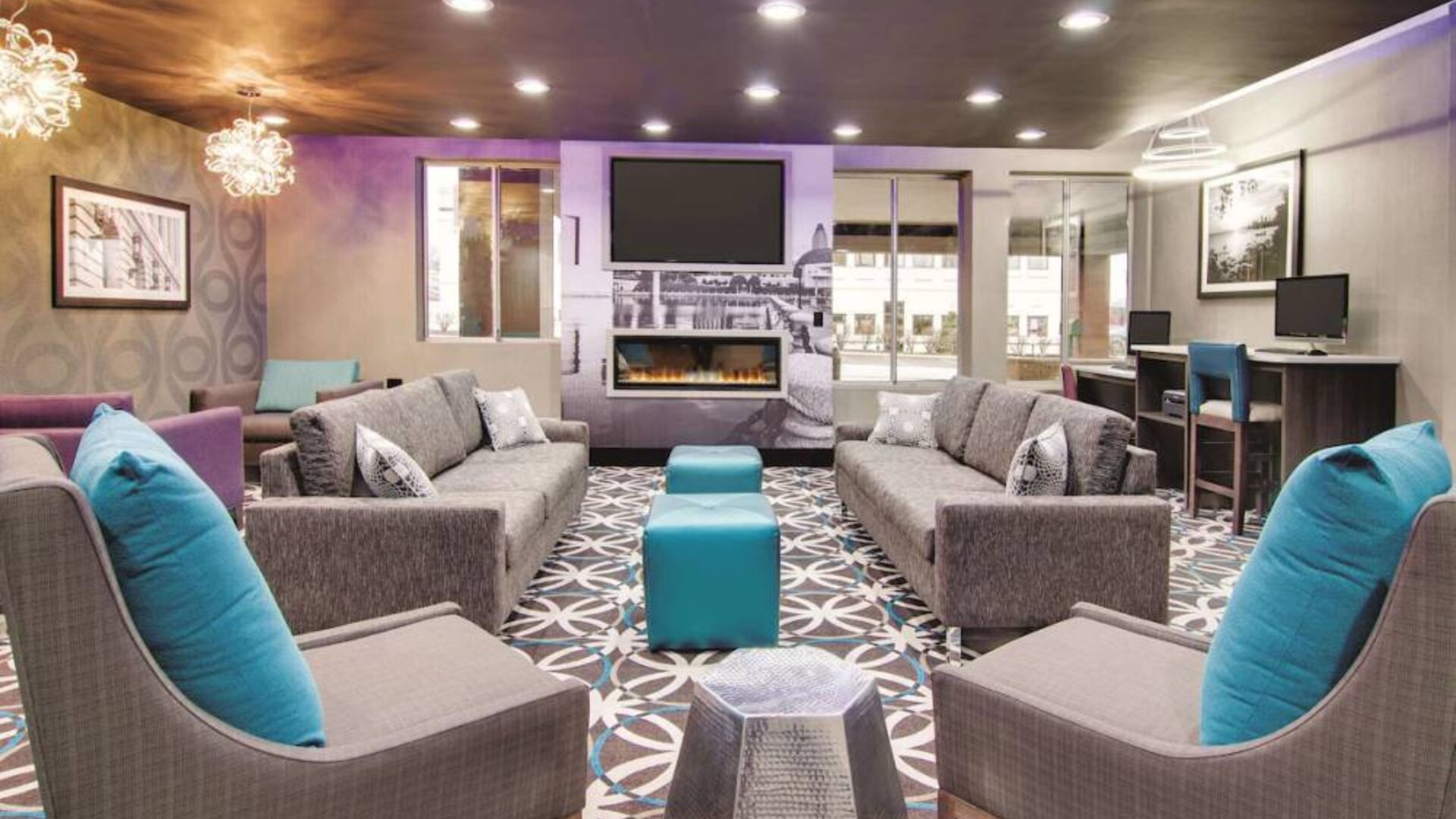Lobby and coworking lounge at La Quinta Inn & Suites Cleveland Airport West.