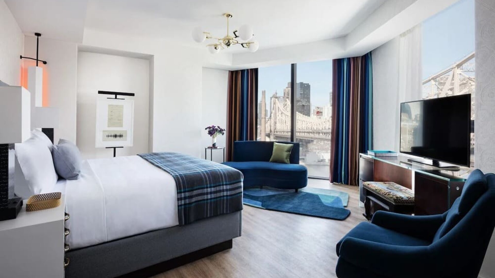 Delux king bed with lots of natural light at Graduate New York.