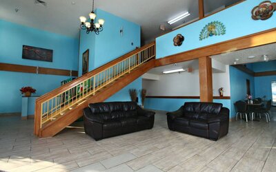 Lobby area at Coratel Inn & Suites By Jasper Newton.