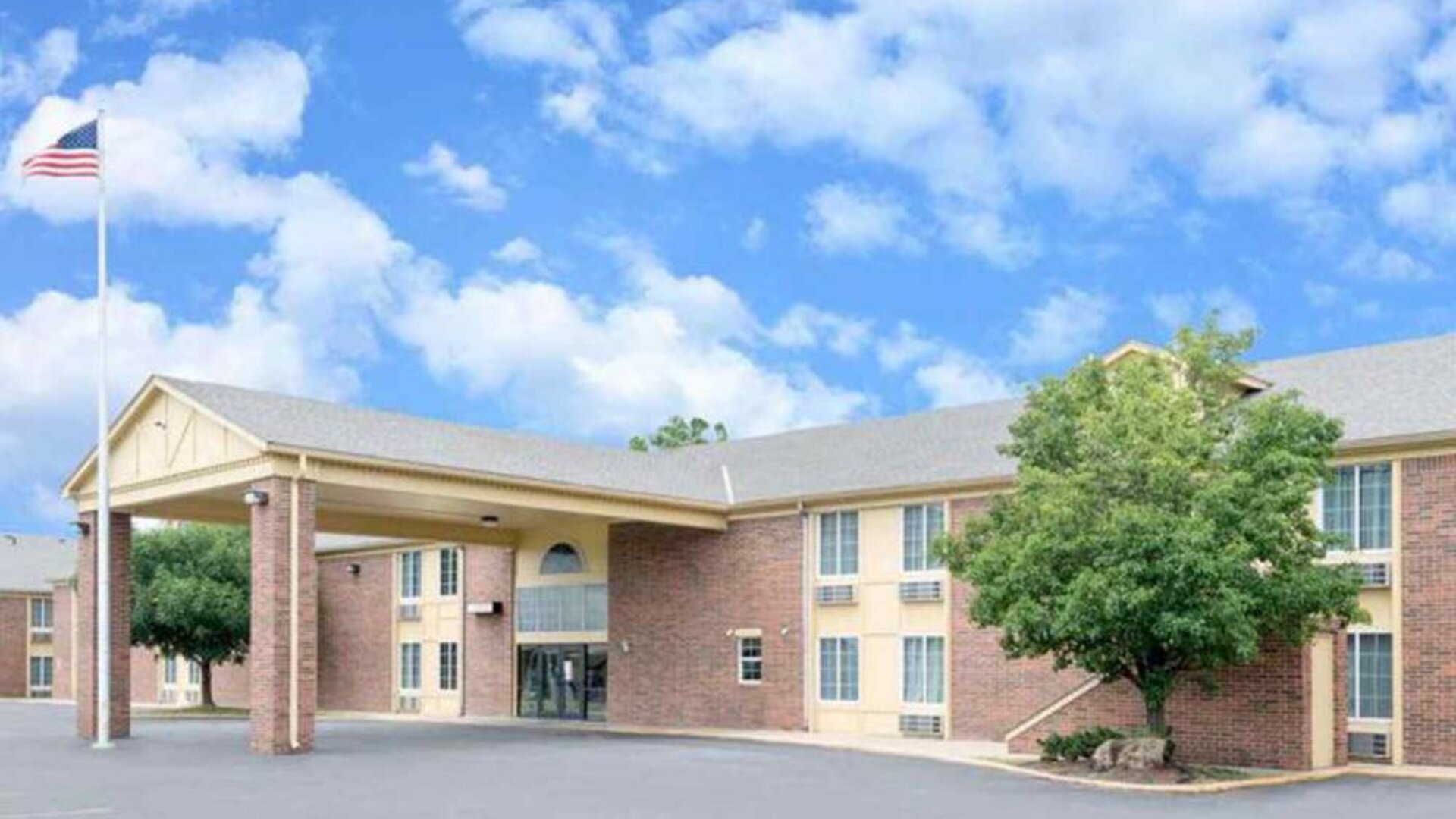 Hotel exterior at Coratel Inn & Suites By Jasper Newton.