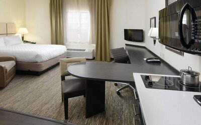 Day use room with work desk and kitchen at Candlewood Suites Odessa.