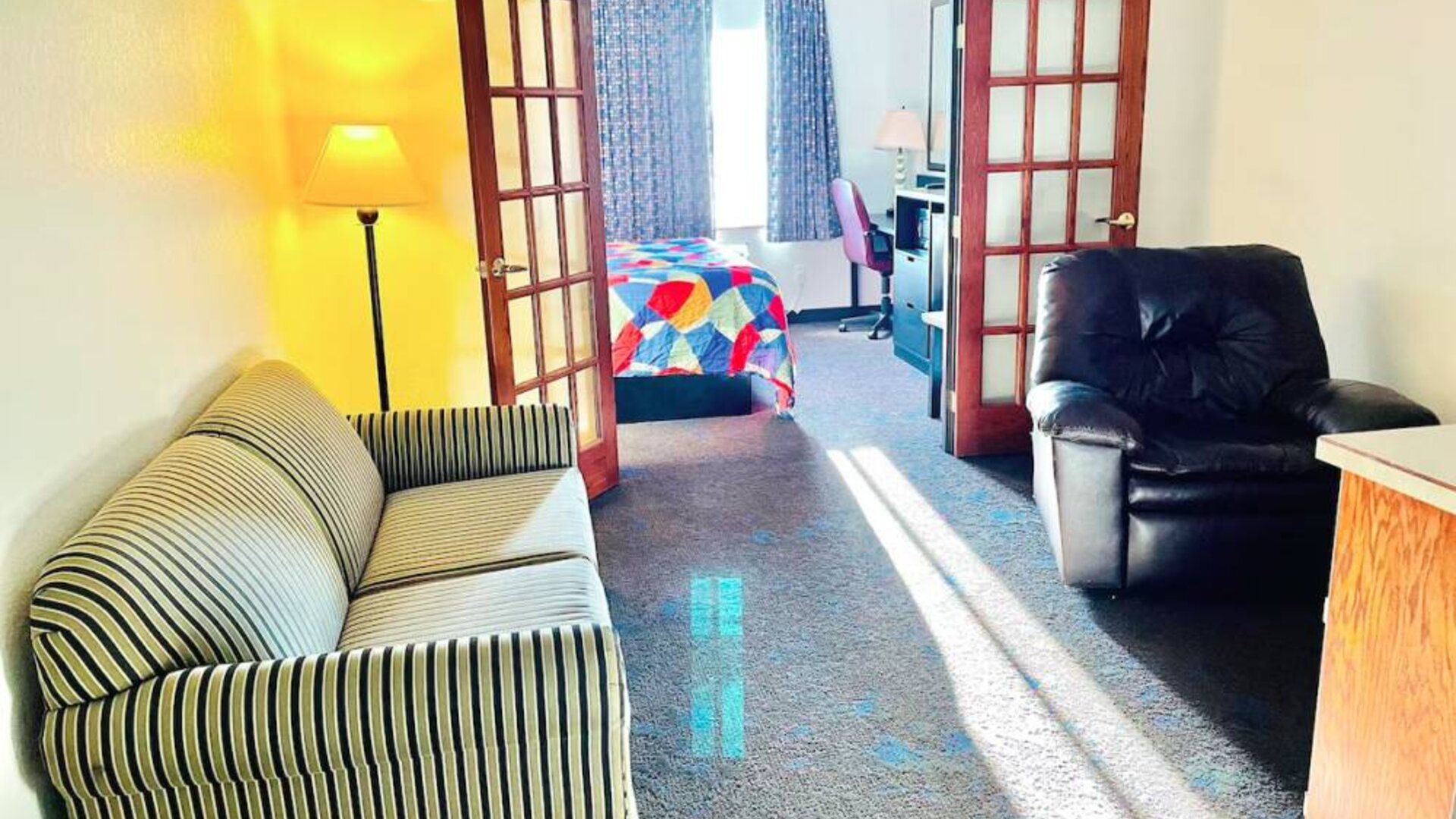 Day use room with living area at Coratel Inn & Suites By Jasper Northfield.