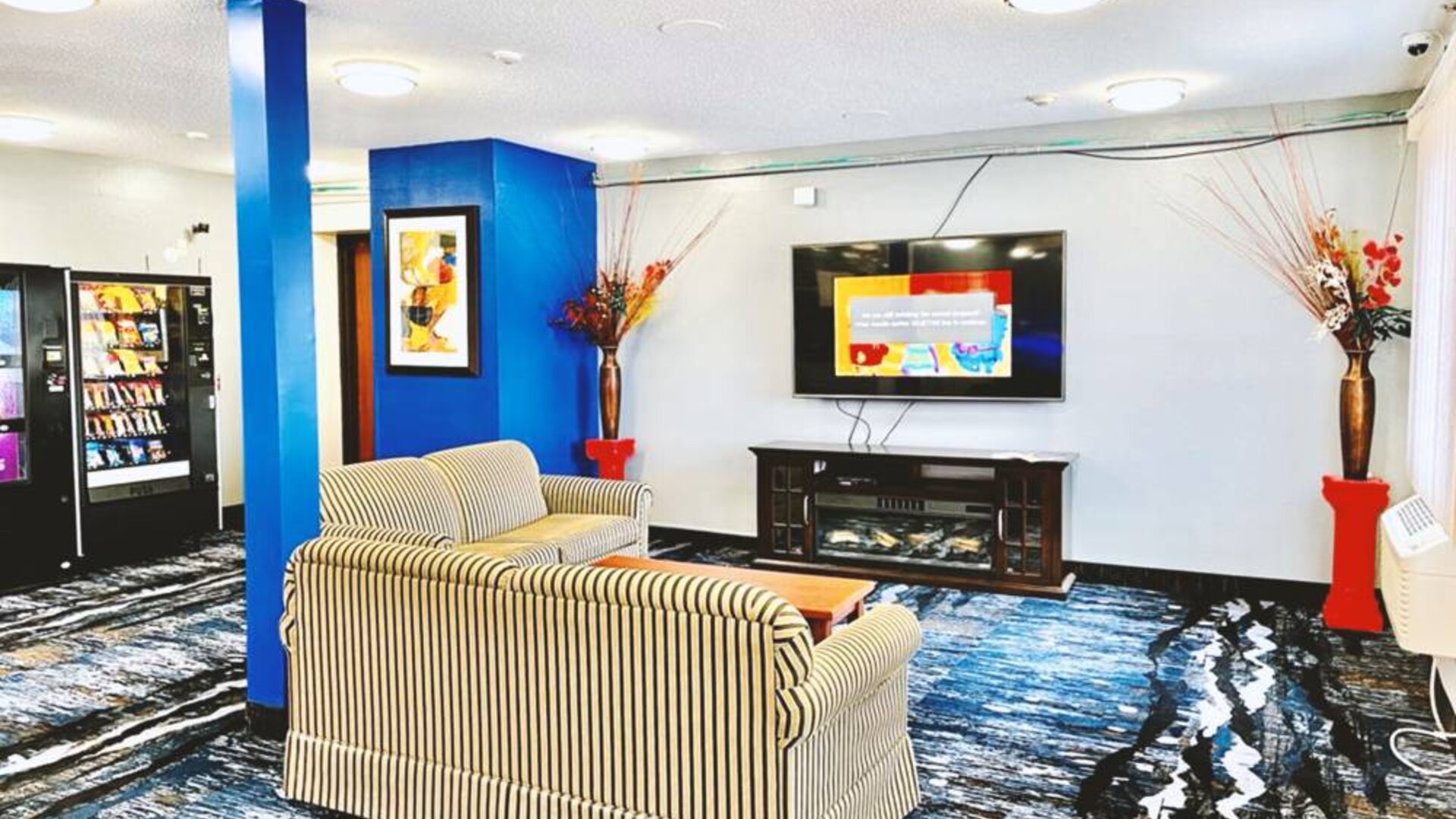 Lobby and coworking lounge at Coratel Inn & Suites By Jasper Northfield.