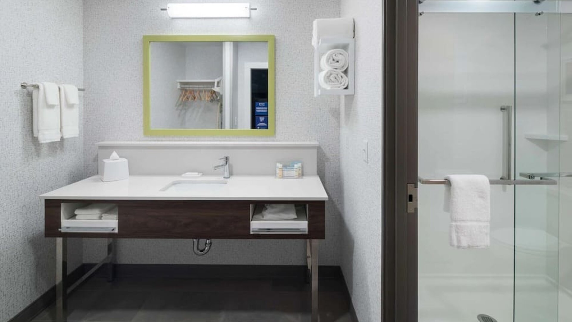 Private guest bathroom with shower at Hampton Inn & Suites Cape Canaveral Cruise Port.