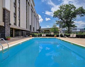Refreshing outdoor pool at Hampton Inn & Suites Alexandria.