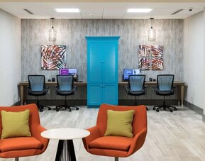 Business center with internet and printer at Home2 Suites By Hilton Cape Canaveral Cruise Port.