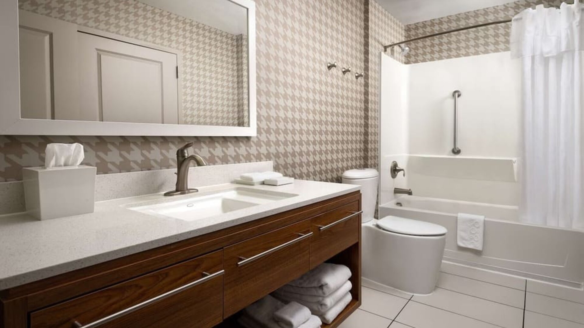 Guest bathroom with shower and bath at Home2 Suites By Hilton Charleston Airport/Convention Center.