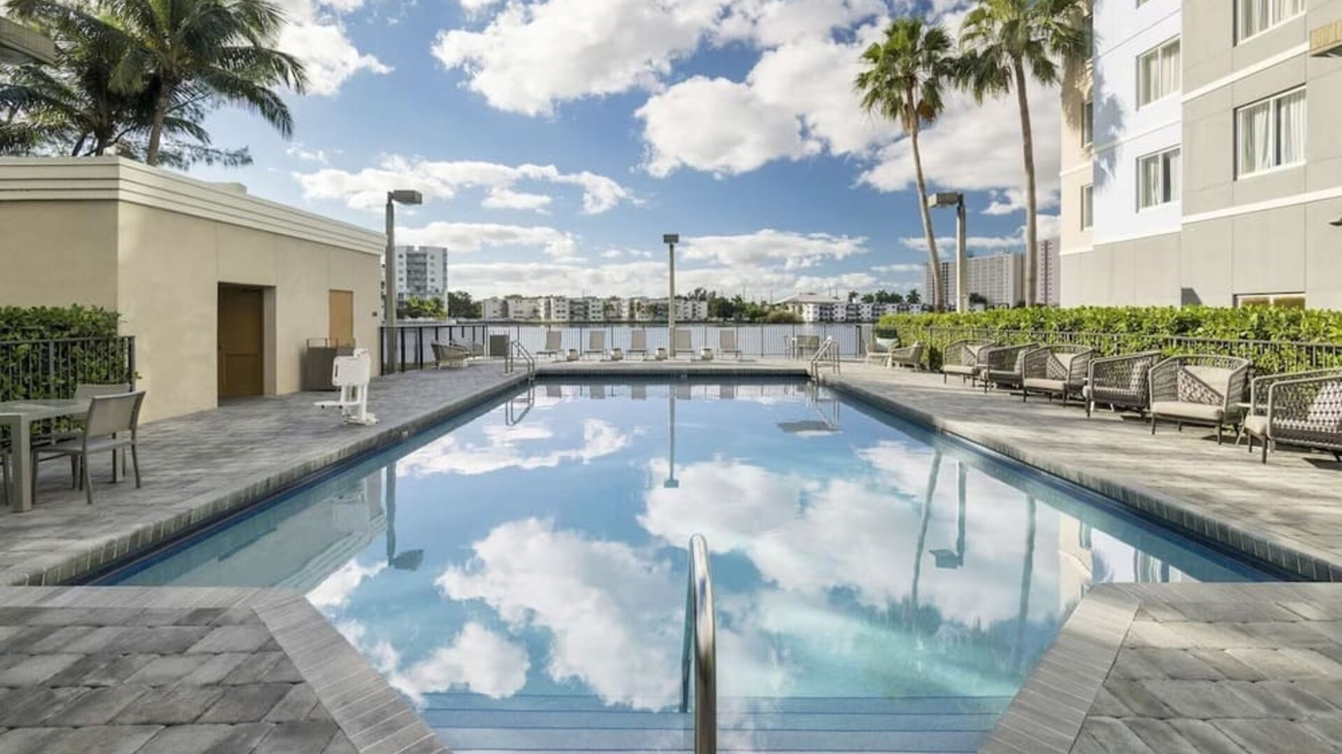Refreshing outdoor pool at Homewood Suites By Hilton Miami Airport-Blue Lagoon.