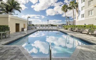 Refreshing outdoor pool at Homewood Suites By Hilton Miami Airport-Blue Lagoon.