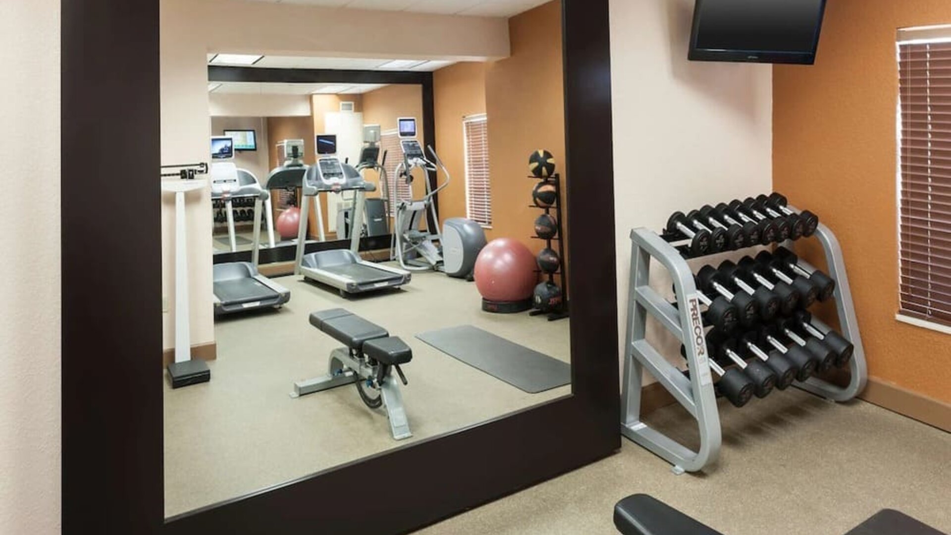 Fitness center at Homewood Suites By Hilton Miami Airport-Blue Lagoon.