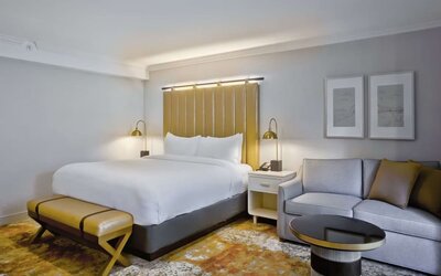 King bed with TV at The Inn At Saratoga, Tapestry Collection By Hilton.