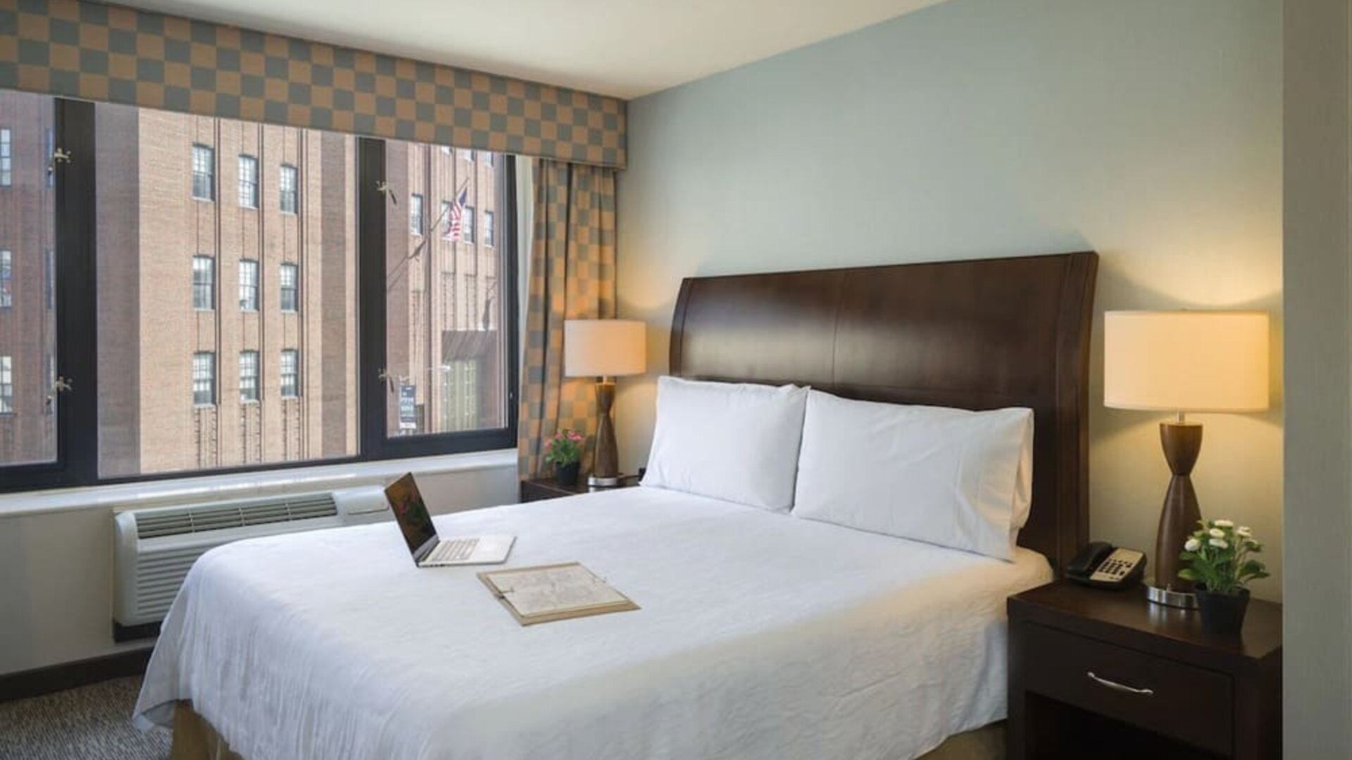 Delux king bed with natural light at Hilton Garden Inn New York/Tribeca.