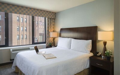 Delux king bed with natural light at Hilton Garden Inn New York/Tribeca.