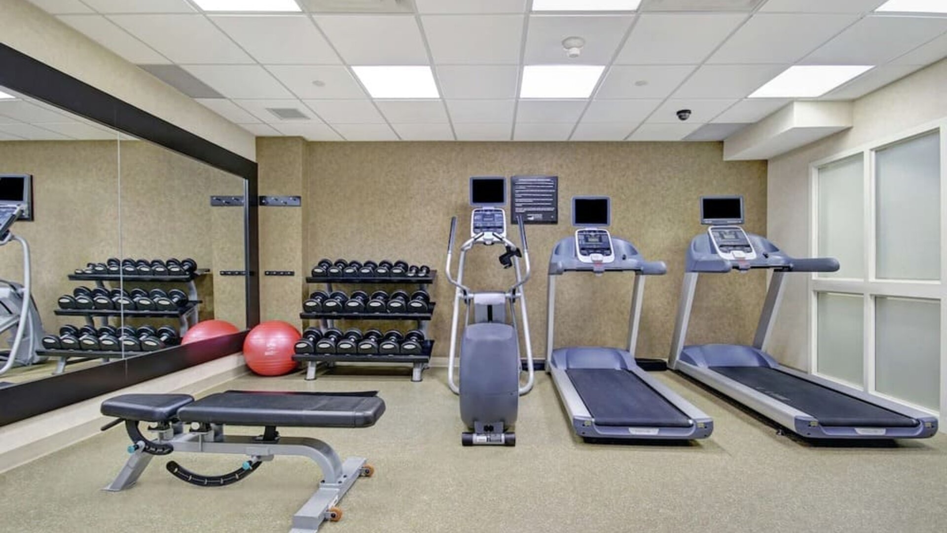 Fitness center available at Homewood Suites By Hilton Burlington.