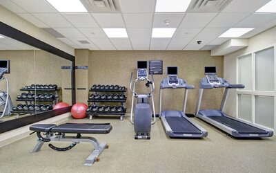 Fitness center available at Homewood Suites By Hilton Burlington.