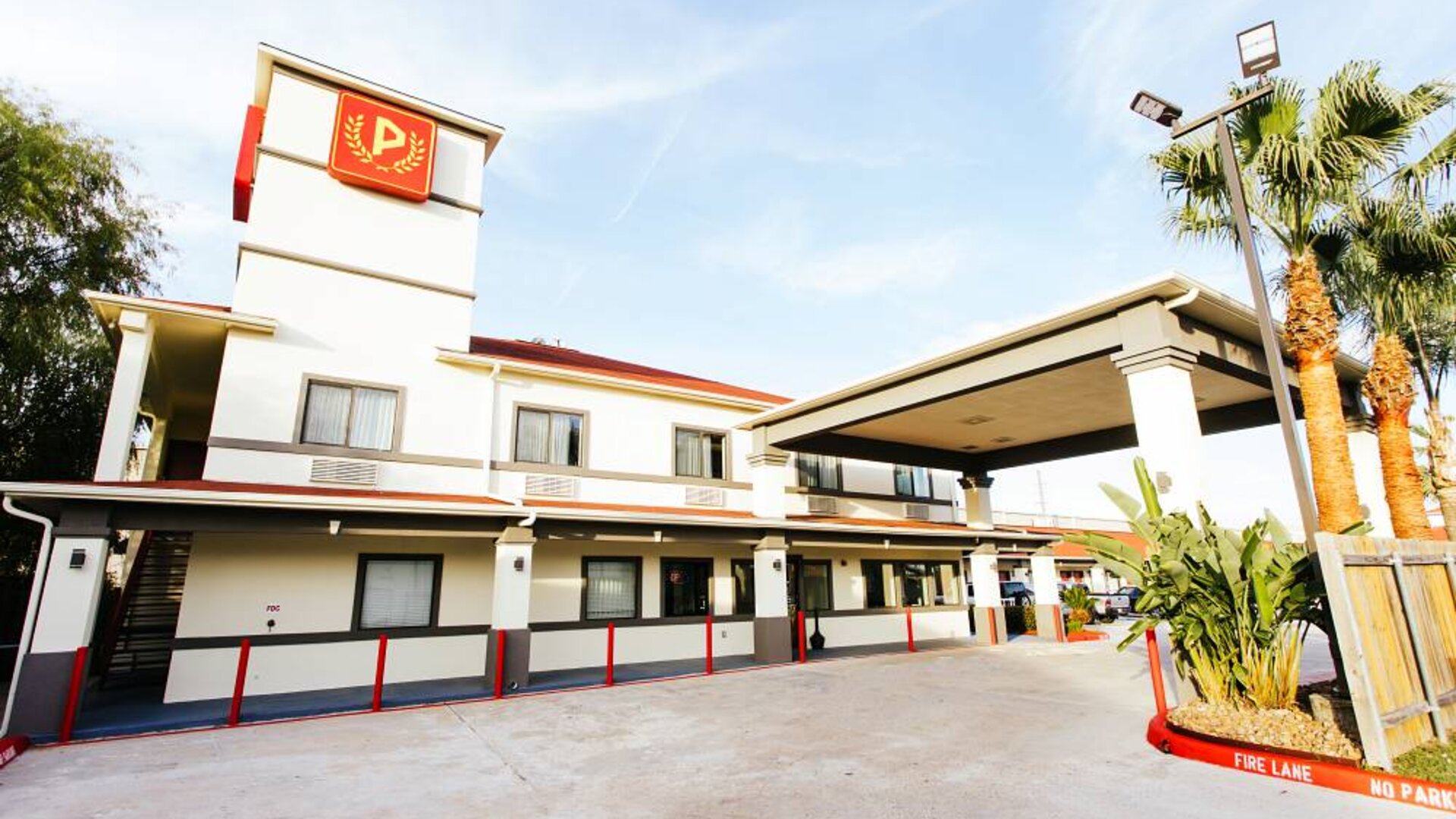 Hotel exterior at Palace Inn TX 249.