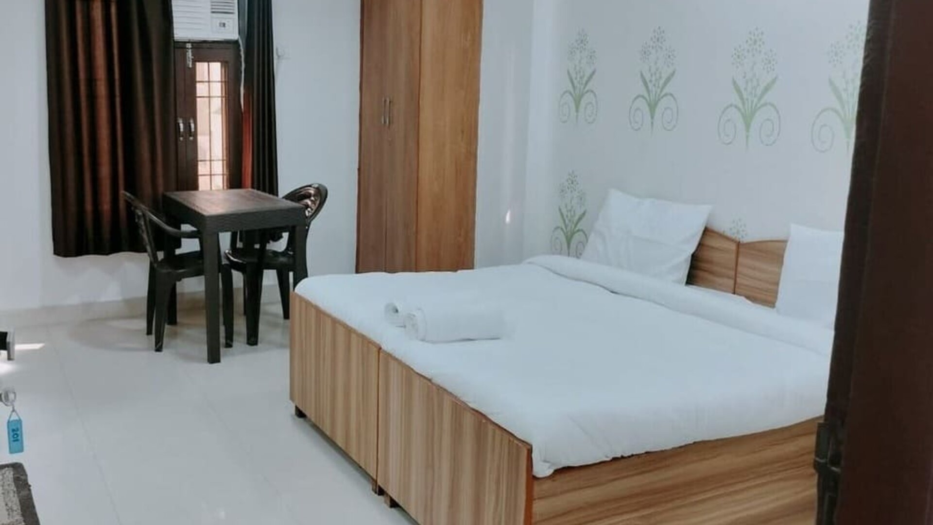 Comfortable king room with natural light at Hotel Urban Abode.