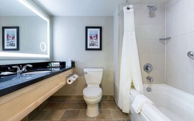 Guest bathroom with shower and bath at Hilton Whistler Resort & Spa.