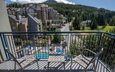 Day rooms with balcony and seating area at Hilton Whistler Resort & Spa.