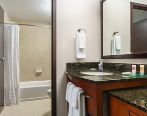 Guest bathroom with shower and tub at Hyatt PLACE Fort Lauderdale Airport - South & Cruise Port.