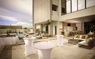 Seats available beside pool and bar at EB Hotel Miami.