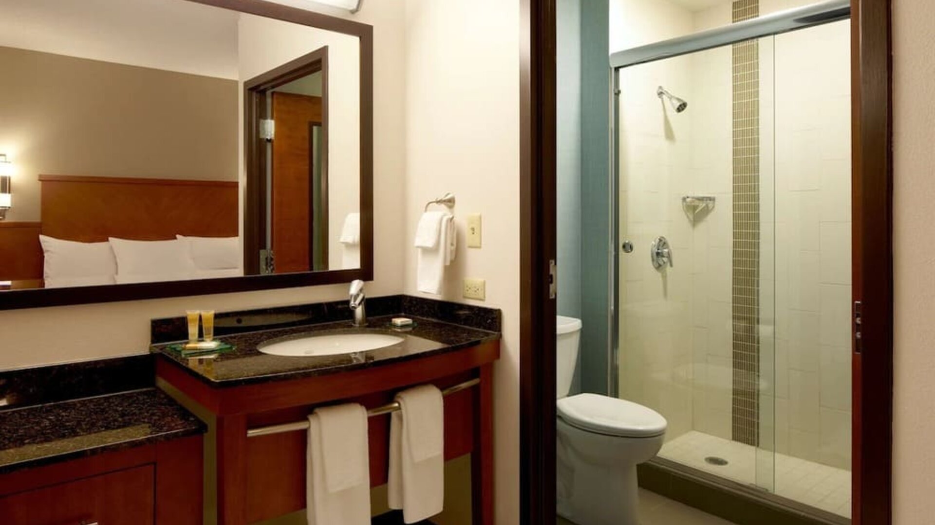 Guest bathroom with shower at Hyatt Place Chicago, Lombard / Oak Brook.