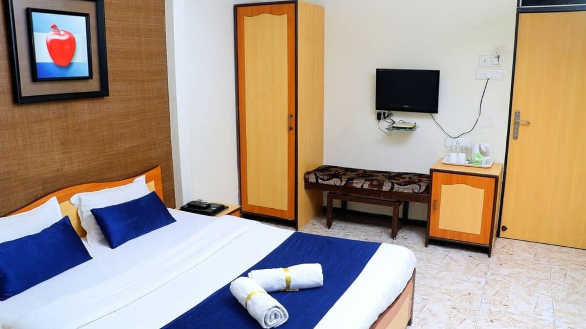 Delux king bed with TV at Hotel Alka Residency.