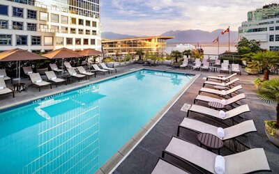 Relaxing outdoor pool with lounge chairs at the Fairmont Waterfront.