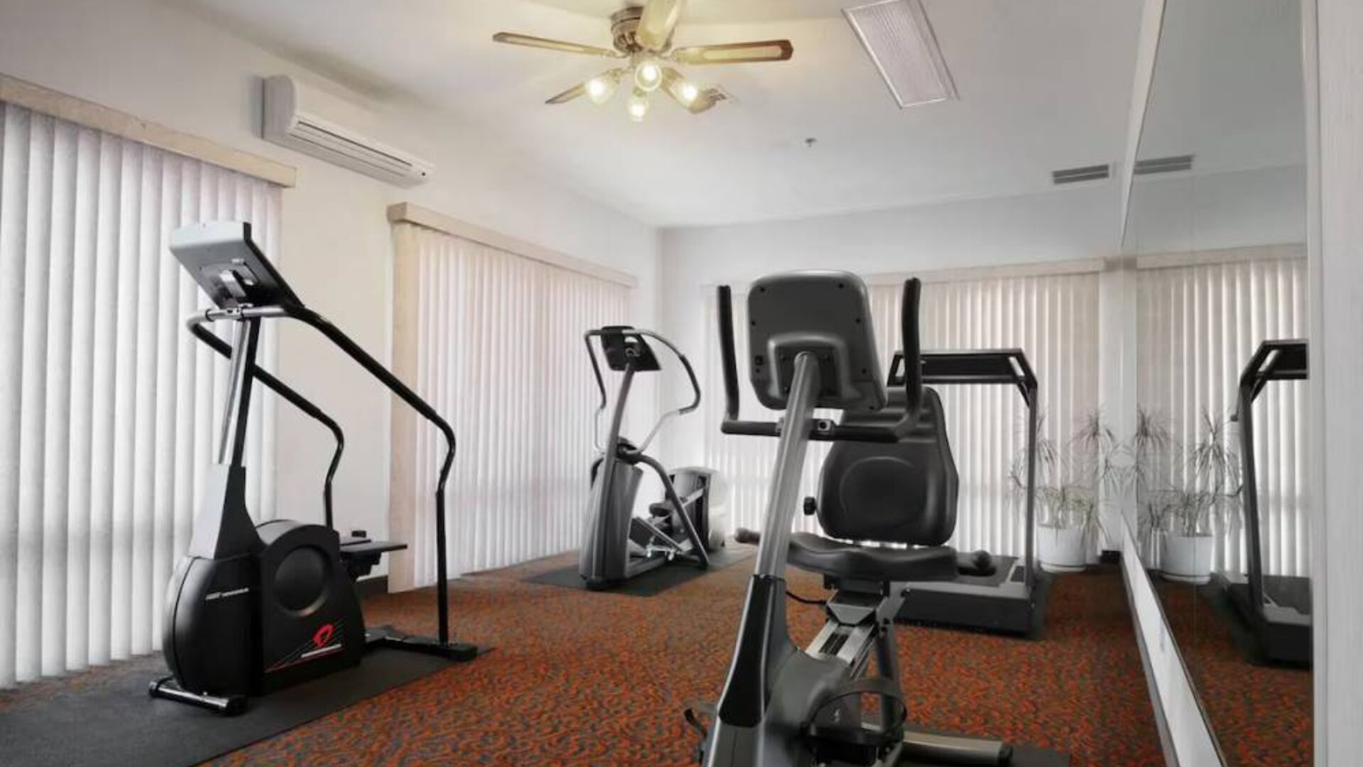 Fitness center available at Coratel Inn & Suites By Jasper New Braunfels IH-35 EXT 189.