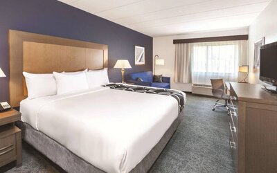 Day use room with work desk and sofa at La Quinta Inn & Suites By Wyndham Philadelphia Airport.
