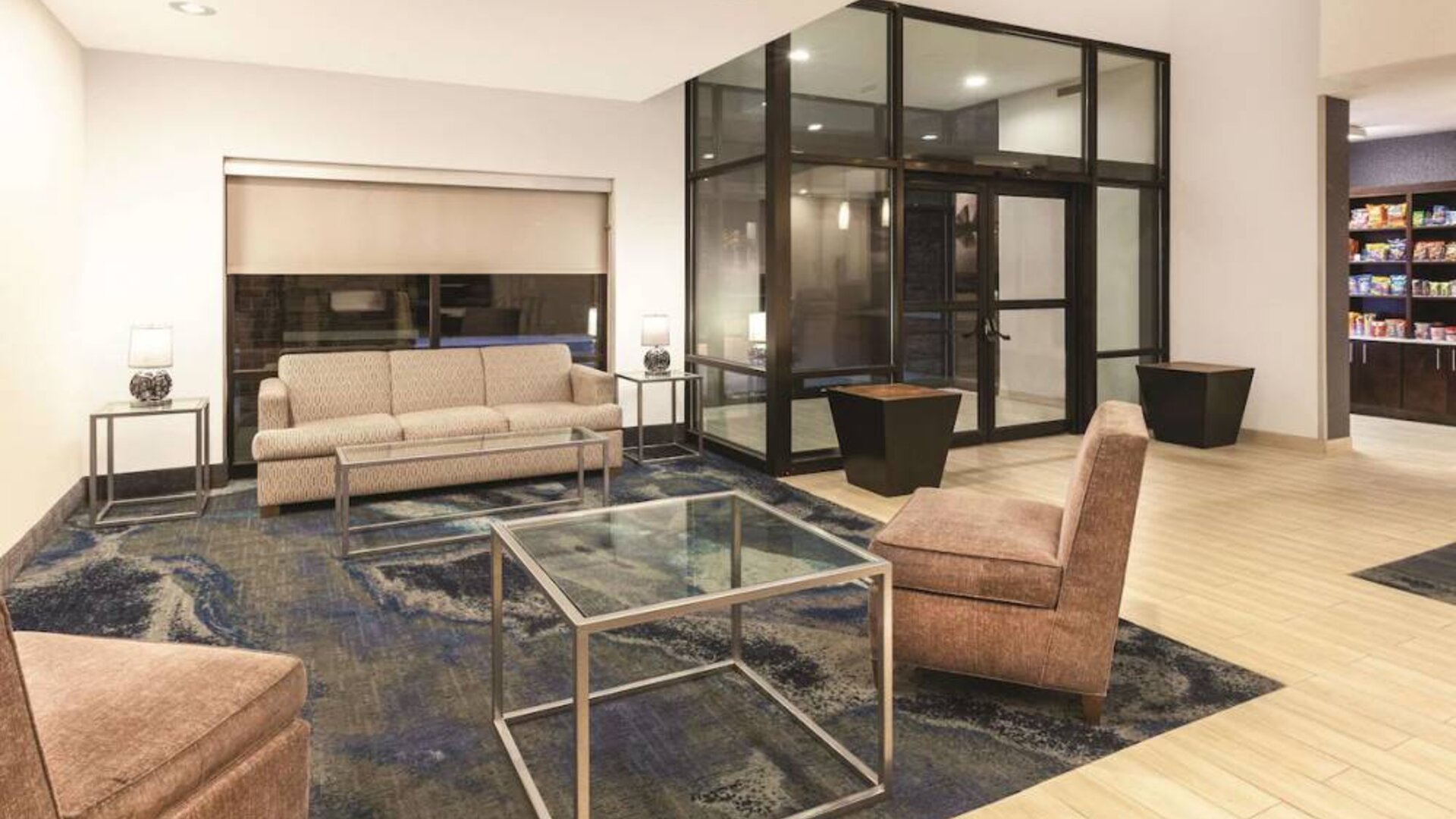 Lobby and coworking lounge at La Quinta Inn & Suites By Wyndham Philadelphia Airport.