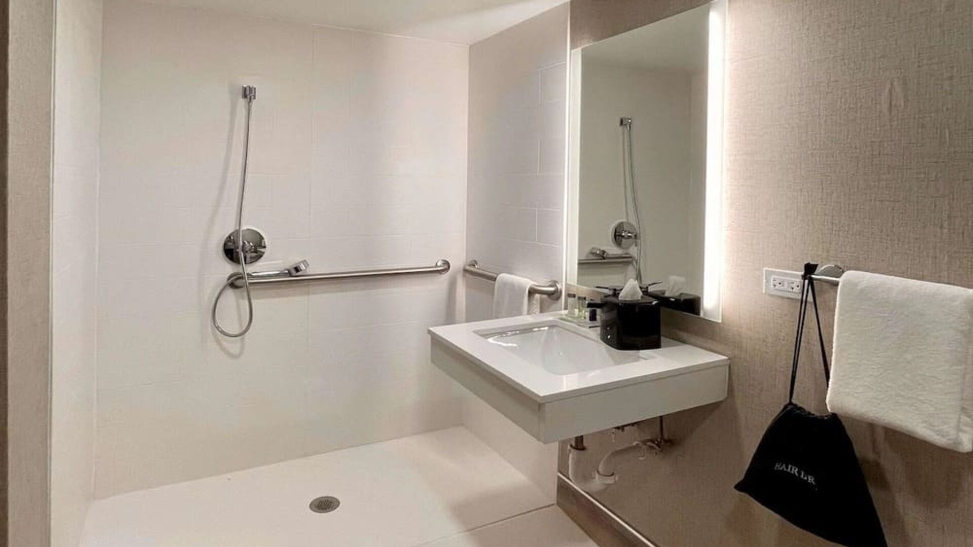 Guest bathroom with shower at Sleep Inn Oakbrook Terrace.