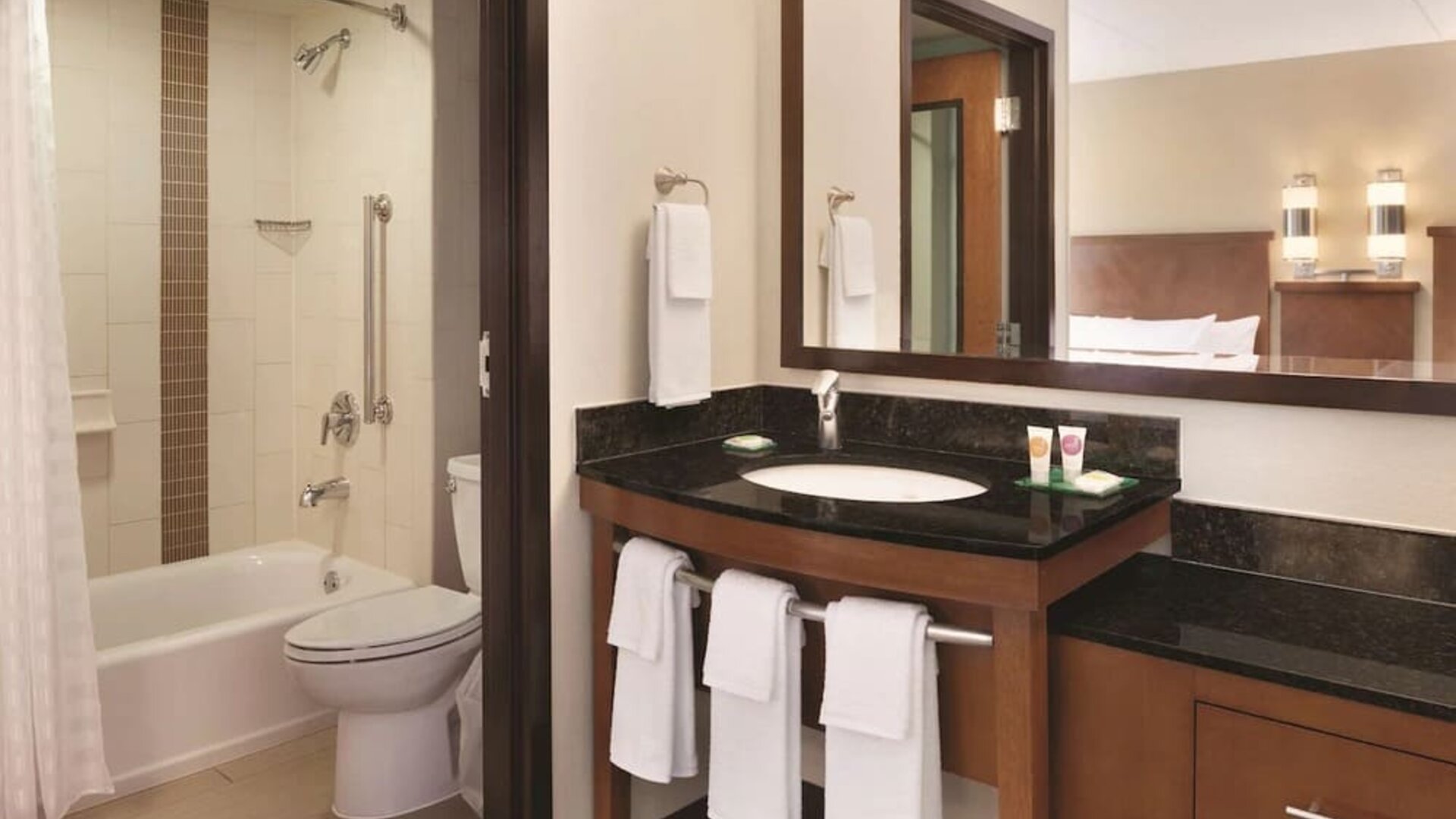 Guest bathroom with shower and tub at Hyatt Place Chicago/Hoffman Estates.