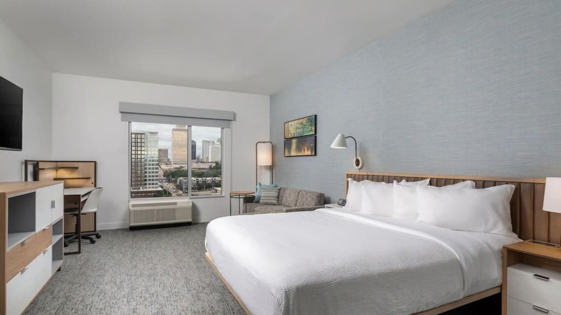 Day use room with work desk and sofa at TownePlace Suites Nashville Midtown.