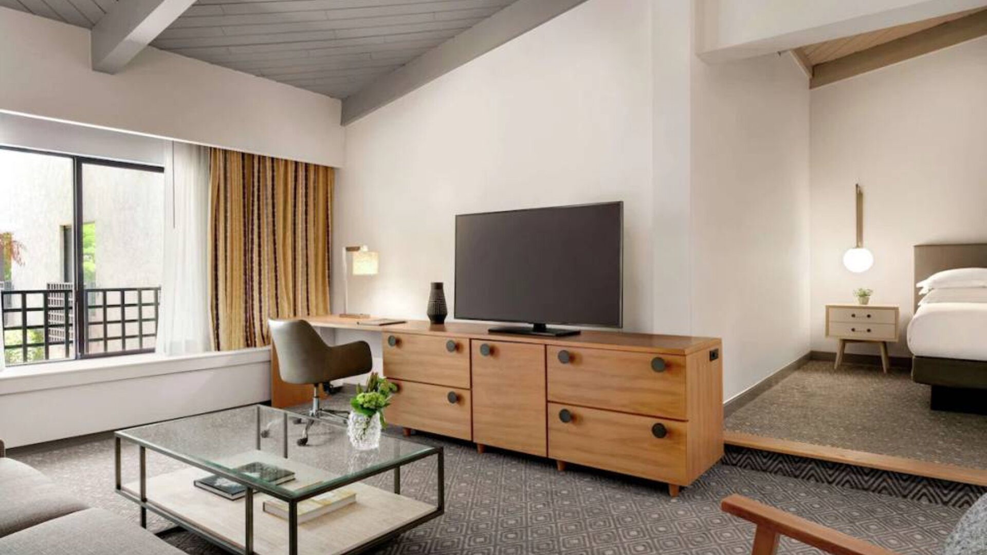 Day use room with TV and lounge area at Hilton Scottsdale Resort & Villas.