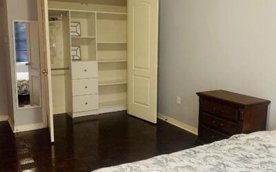 King bed with closet space at Home Stay Canada.