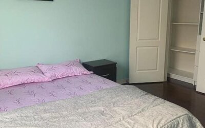 Delux king room with natural light at Home Stay Canada.