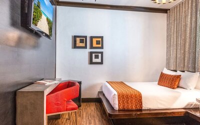 Delux king room with TV at Hotel Chelsea, A South Beach Group Hotel.