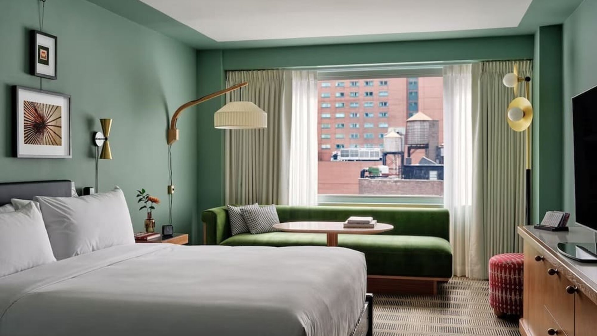 Day room with kitchenette and lounge area at Romer Hell's Kitchen.