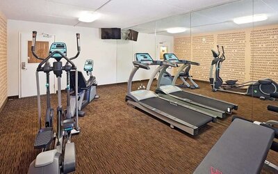 Fitness center at Norwood Inn Statefare Grounds.