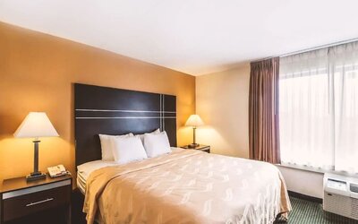 King bed at Hotel Inn Milwaukee.