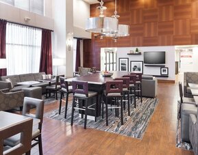 Dining area perfect for coworking at Hampton Inn Los Angeles-Orange County-Cypress.