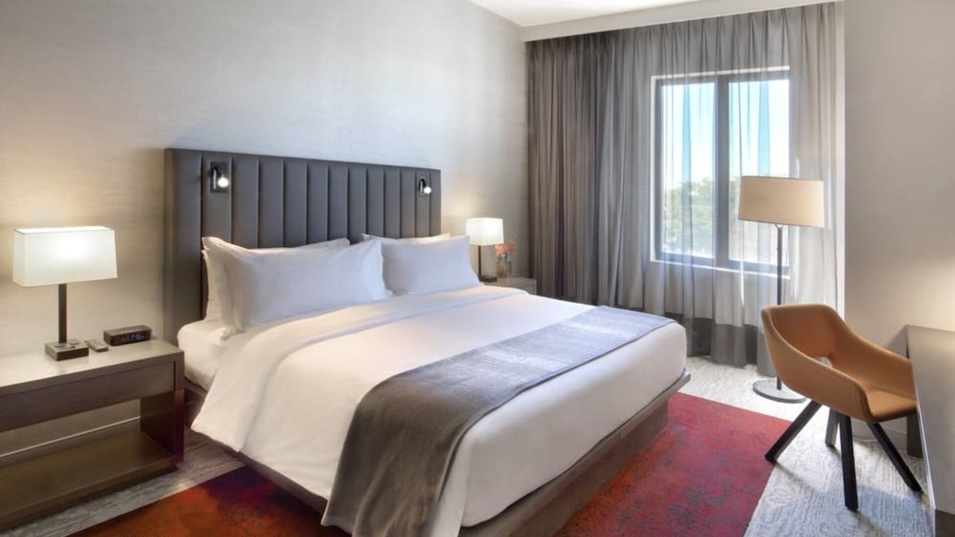 Delux king bed with TV and business desk at Fairfield Inn & Suites By Marriott Kenosha Pleasant Prairie.