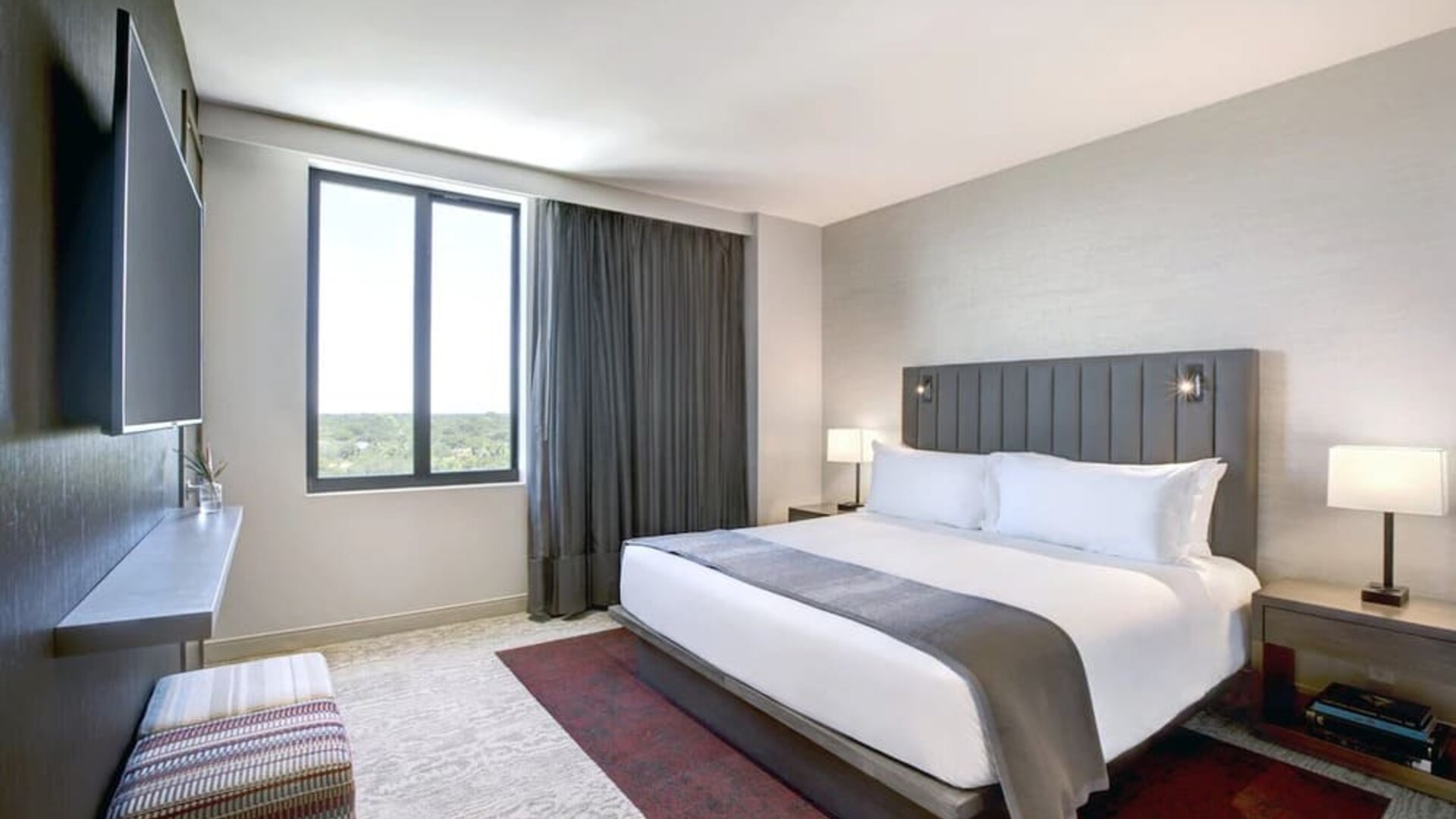 King bed with lounge area and natural light at Fairfield Inn & Suites By Marriott Kenosha Pleasant Prairie.