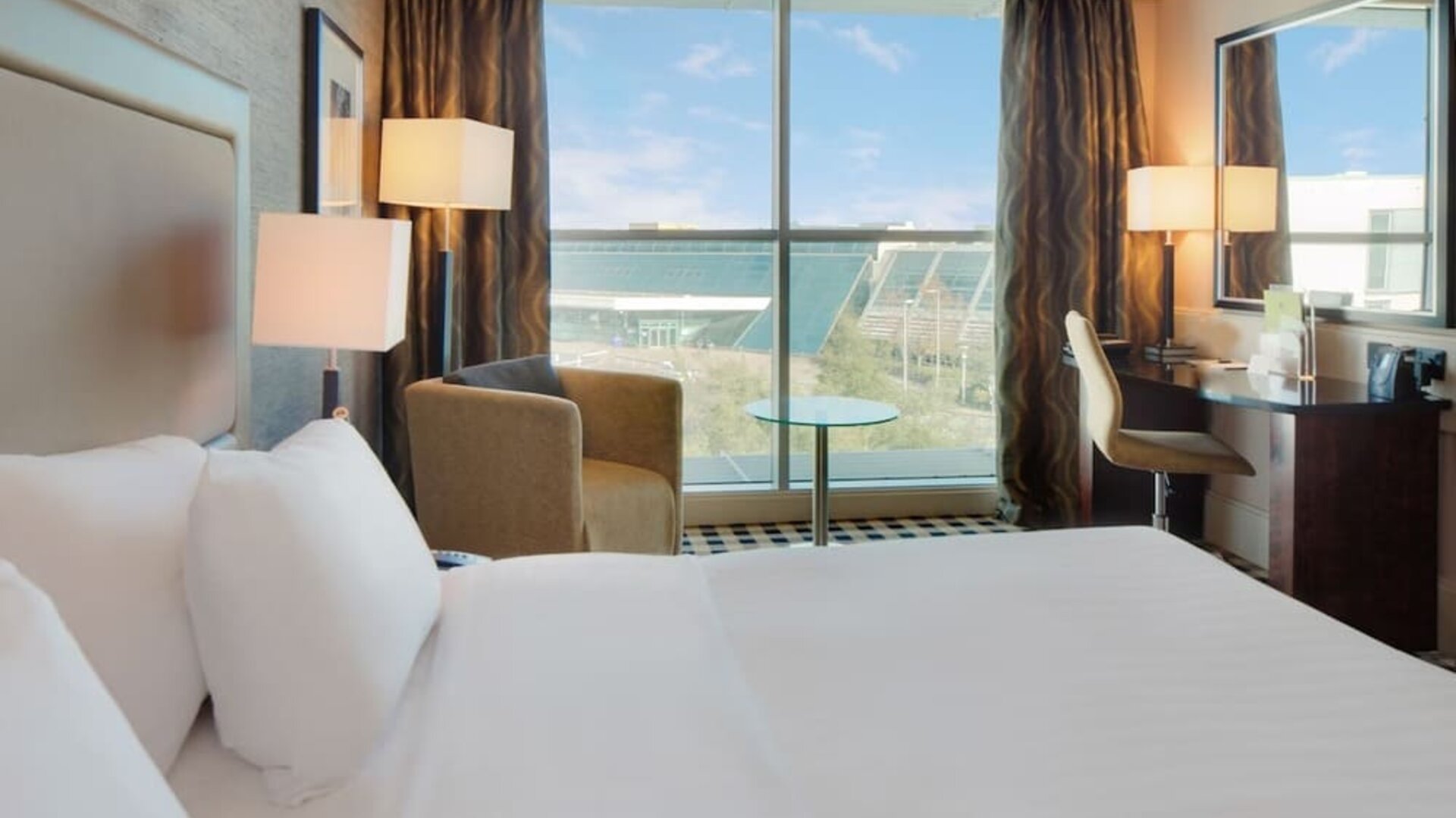 Day use room with work desk and lounge seating at DoubleTree By Hilton Newcastle International Airport.