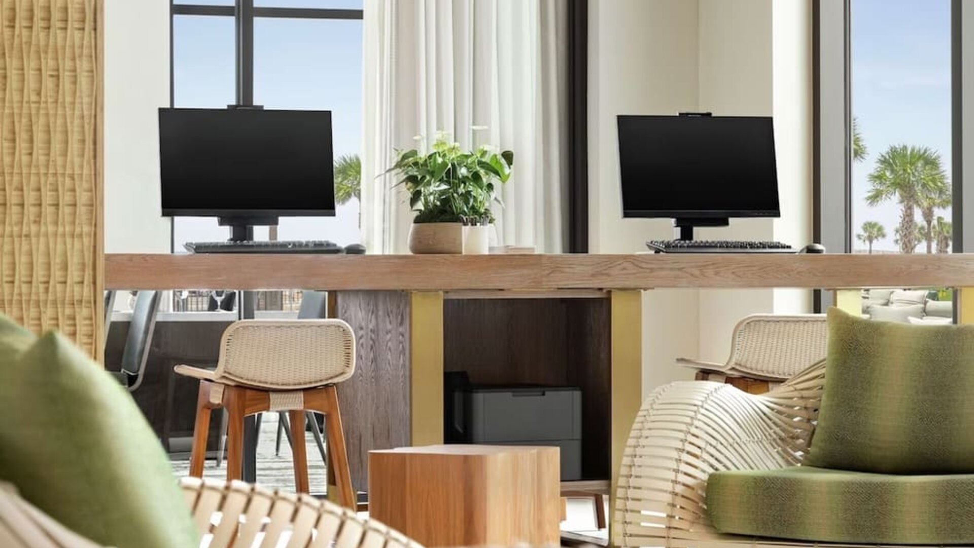 Business center with computers and printer at Embassy Suites By Hilton Panama City Beach Resort.